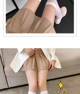 Detailed closeup shot of Japanese style pleated skirt matching with white crew socks.