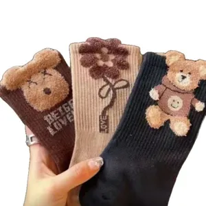 Cute fuzzy bear mid-tube socks set, warm plush winter hosiery with floral patterns for daily wear.