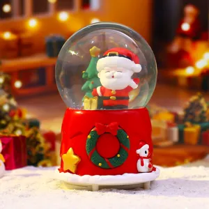 Christmas snow globe figurine with Santa Claus and music box base for holiday decor and gifts.