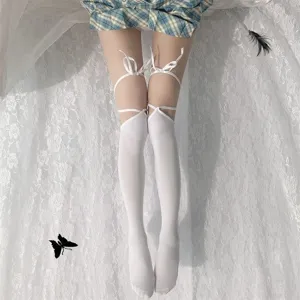 White over-the-knee socks with bow tie straps, sweet JK style fashion leg wear accessory.