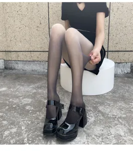 Gradient sheer pantyhose for women, anti-snag Japanese JK velvet tights, detail view showing stretch.