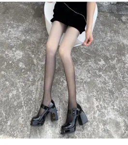 Detail view of women gradient sheer pantyhose showing leg shape and smooth texture.