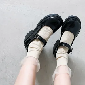 Stylish black Mary Jane shoes paired with cozy socks for cute Japanese fashion looks.