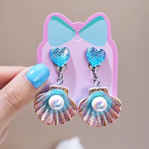 Kids clip-on earrings featuring cute heart glitter and iridescent shell pearl pendants for party.