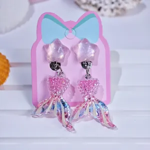 Children cute star mermaid tail clip-on earrings detail shot, perfect for party dress up.