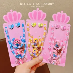 Detailed close-up of cute children mermaid necklace bracelet and earrings set with colorful beads.