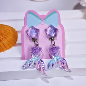 Children clip on earrings with purple star and mermaid tail pendants, cute princess style.
