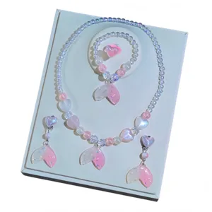 Children mermaid jewelry set featuring beaded necklace, bracelet, earrings and cute ring details.