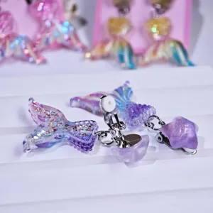 Kids clip-on earrings glitter purple mermaid tail star design cute accessories detail view