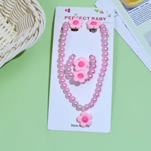 Cute kids pink pearl necklace bracelet earrings set with lovely flower charms detail view