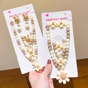 Cute children jewelry set with resin rabbit and flower beads for sweet little girls.
