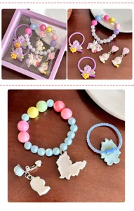 Cute children unicorn bracelet set detailed view, featuring colorful beads, hair ties and clips.