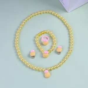 Kids yellow faux pearl jewelry set with cute pineapple charms, necklace bracelet ring earrings.