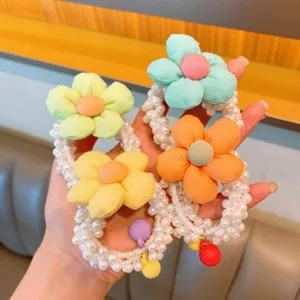 Pearl flower hair ties detail view, cute colorful fabric floral design for girls daily wear.