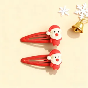 Cute Christmas Santa Claus hair clips detail view, red snap clips for kids and sweet girls.