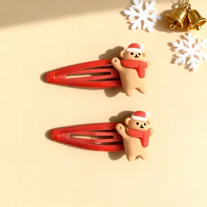 Cute Christmas hair clips for kids, featuring red teardrop clips and adorable bear charms with hats.