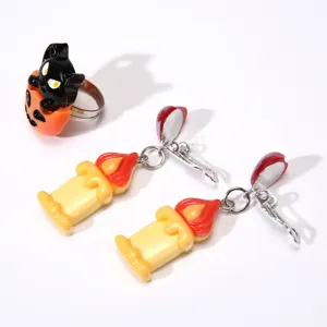 Halloween kids jewelry set featuring cute black cat ring and melting candle clip-on earrings.