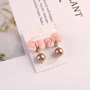 Cute pink bowknot clip-on earrings with bronze pearl pendants for kids girls party gift wear