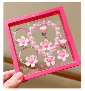 Kids pink flower pearl bracelet and hair accessories gift box set for little girls, detail view.