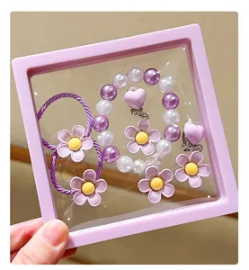 Kids flower pearl bracelet set cute purple hair ties and clip earrings detail view