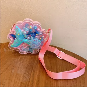 Kids transparent shell crossbody bag with mermaid tail sequins and blue bead jewelry set details.