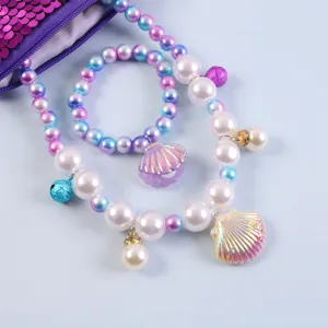 Kids mermaid pearl necklace bracelet set with shell pendant and glitter pouch for girls.