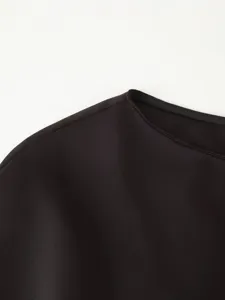 Black dress collar shoulder detail autumn winter women fashion minimalist clothing close up