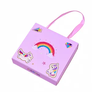 Pink unicorn gift box with ribbon handle and cute cartoon rainbow design for kids jewelry sets.