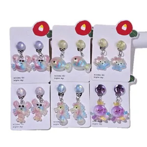 Kids clip-on earrings, cute ocean cartoon design, pain-free resin jewelry for little girls.
