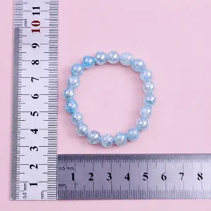 Close-up detail of blue cracked bead bracelet, 8mm beads, 16mm circumference showcase.