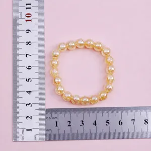 Gold crystal beaded bracelet with 8mm beads, 20 pieces, 16cm circumference detail view.