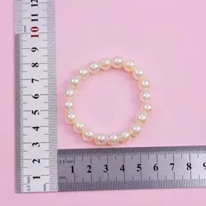 Light yellow beaded bracelet detail view, 8mm shiny colorful beads sweet style kids jewelry.