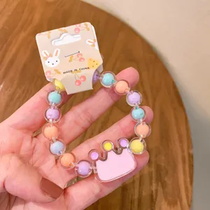 Detailed view of children's colorful jelly bead bracelet with crown pendant and card.