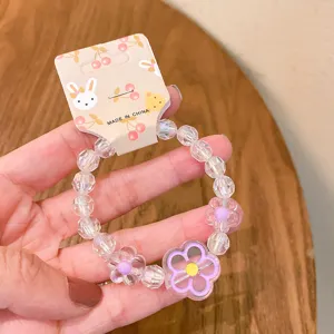 Cute jelly color crystal bead bracelet with purple flower pendant for kids and girls daily wear.