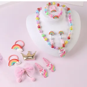 Kids colorful rainbow unicorn beaded necklace bracelet ring hair clips set detail view.