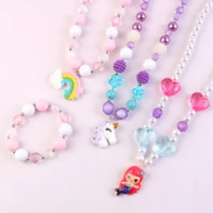 Detailed view of kids cute beaded necklace and bracelet set featuring unicorn and mermaid charms.