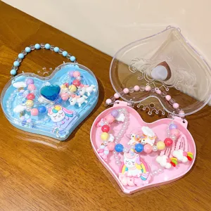 Cute kids heart jewelry box set with unicorn necklaces, bracelets, and hair clips for girls.