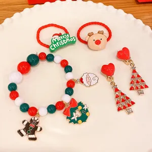 Kids Christmas jewelry set featuring beaded bracelet, hair ties and cute festive earrings.