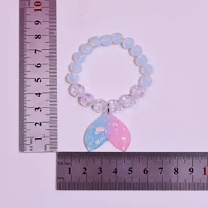 Children beaded bracelet with cute mermaid tail pendant, lovely princess jewelry accessory for girls.