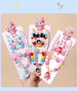 Detailed shot of children colorful beaded necklace and bracelet sets with cute princess pendants.