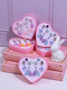 Cute kids clip-on earrings set featuring lovely mermaid tails and starfishes in pink heart boxes.