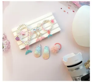 Children mermaid jewelry set details, including gradient tail necklace, bracelet and cute hair clips.