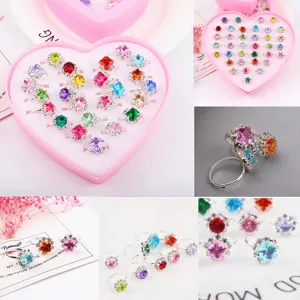 Kids rhinestone ring set detail view, adjustable metal bands with colorful crystal gems.