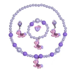 Close-up of the cute children purple pony necklace bracelet and earrings jewelry set details.