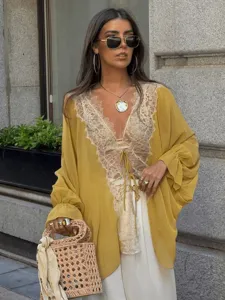 Close-up showcase of the yellow chiffon lace patchwork cardigan with V-neck and nice tie front.