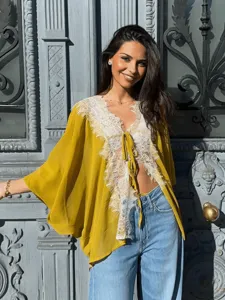 Detail view of the elegant women summer french lace patchwork chiffon cardigan with long sleeves.