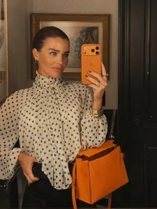 Details of the French style polka dot high neck long sleeve blouse, elegant tie bow design.