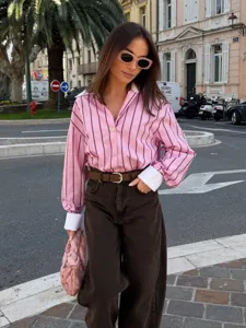 Pink and brown striped casual long sleeve shirt detail view with white lapel collar and cuffs.