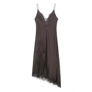 Satin slip dress featuring delicate lace trim on the V-neck and asymmetric hem detail.