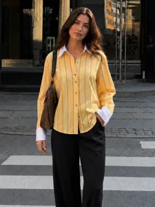 Detailed view of the yellow striped long-sleeve shirt with white lapel and cuffs for women.